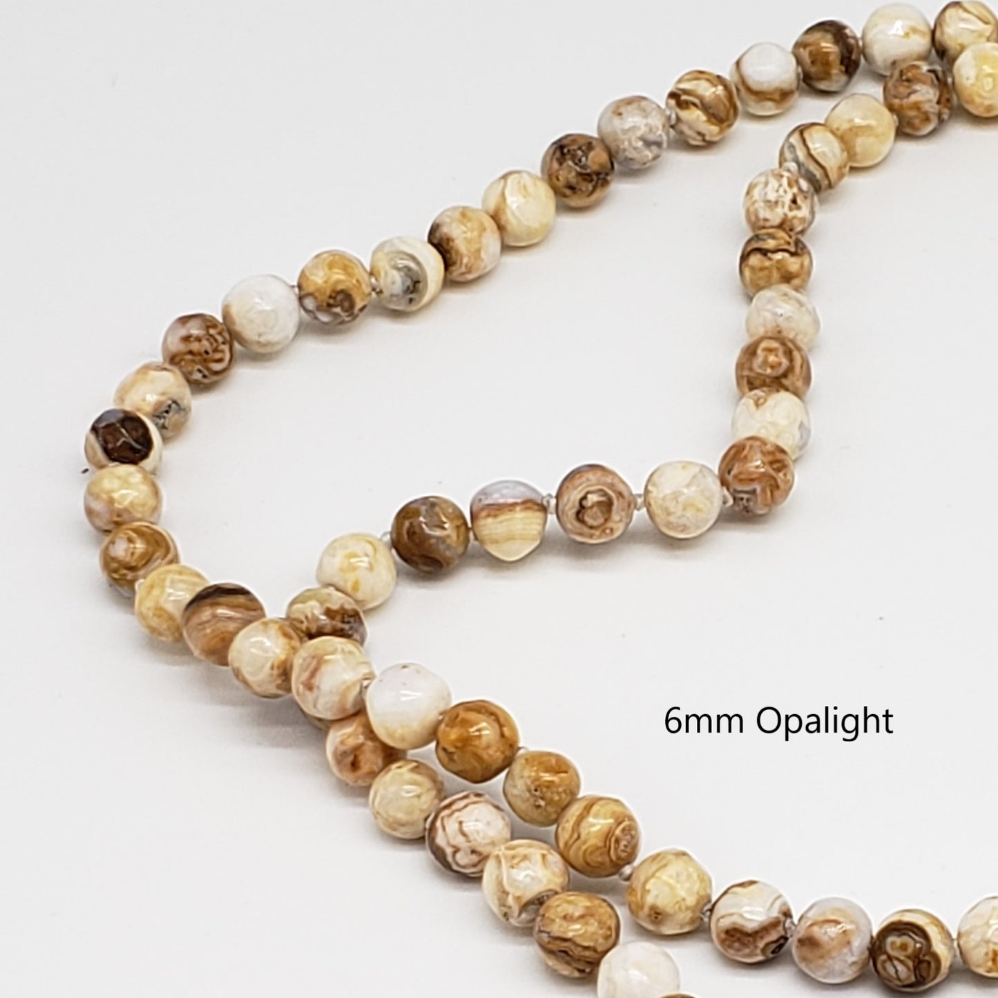 Crystal healing Opalight gemstone necklace known for resolving the karmic causes of a physical condition