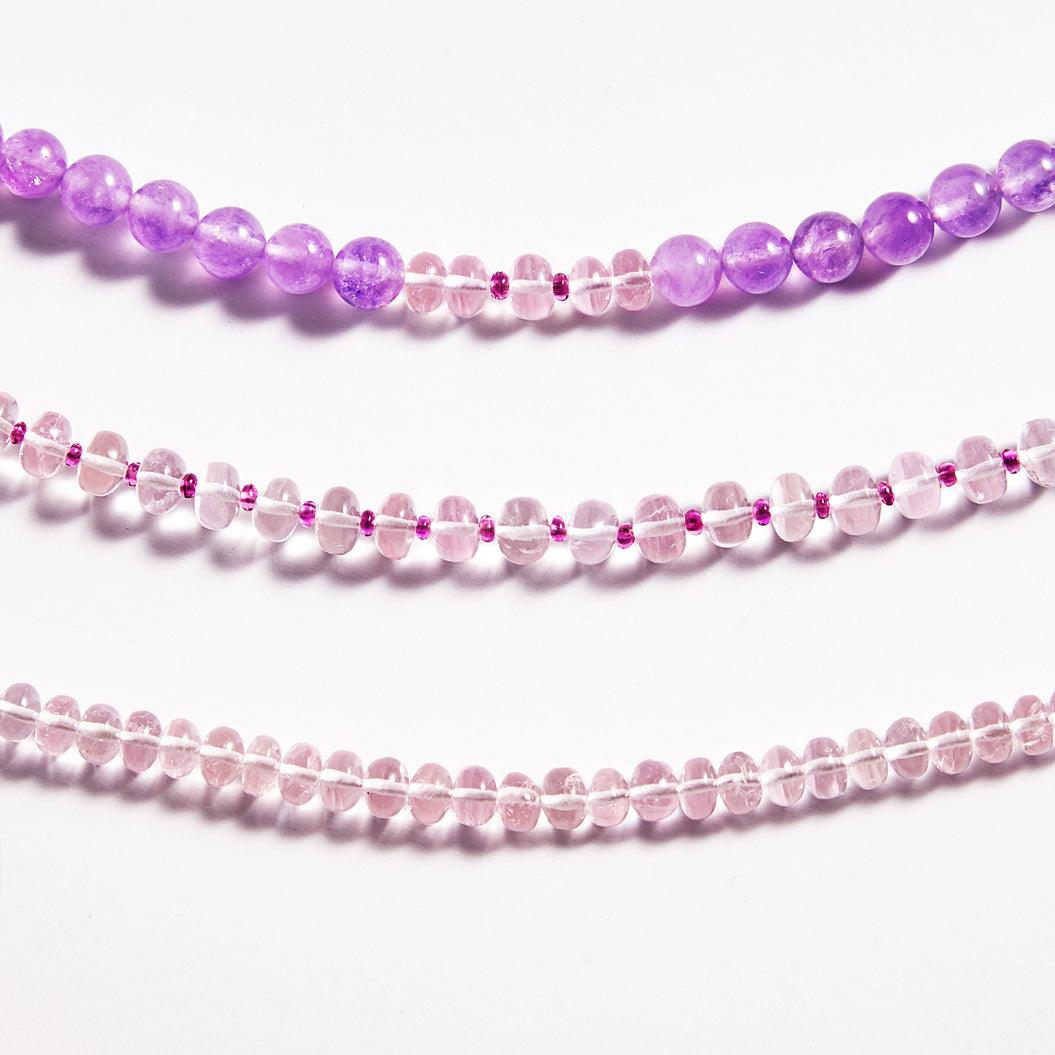 Three different gemstones with Morganite on a white background