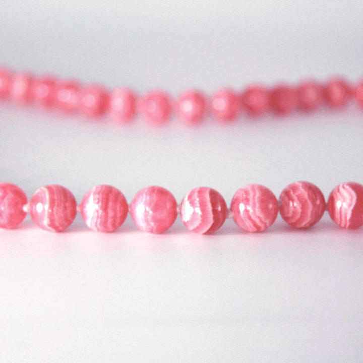Crystal healing Rhodochrosite necklace known for helping you break free from unhealthy patterns and habits