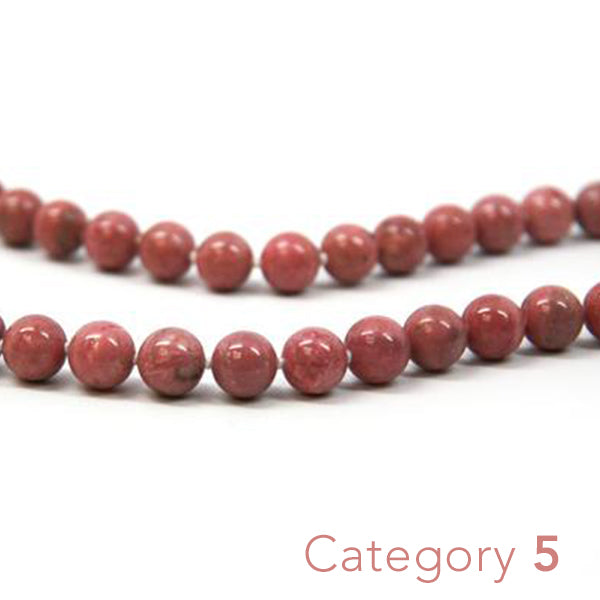 Crystal healing Rhodonite gemstone necklace known for fostering emotional strength and stability