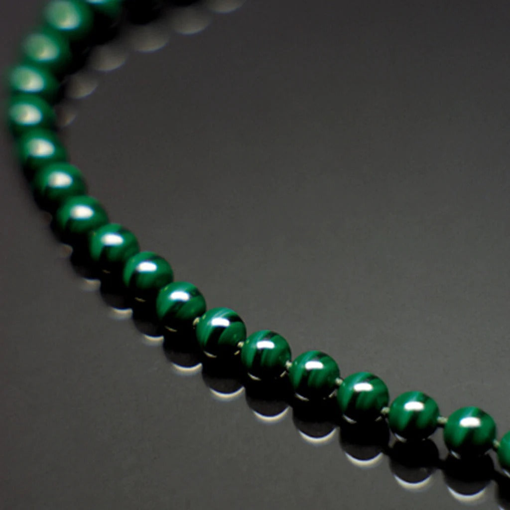 Crystal healing Malachite gemstone necklace known for increasing communication throughout the body